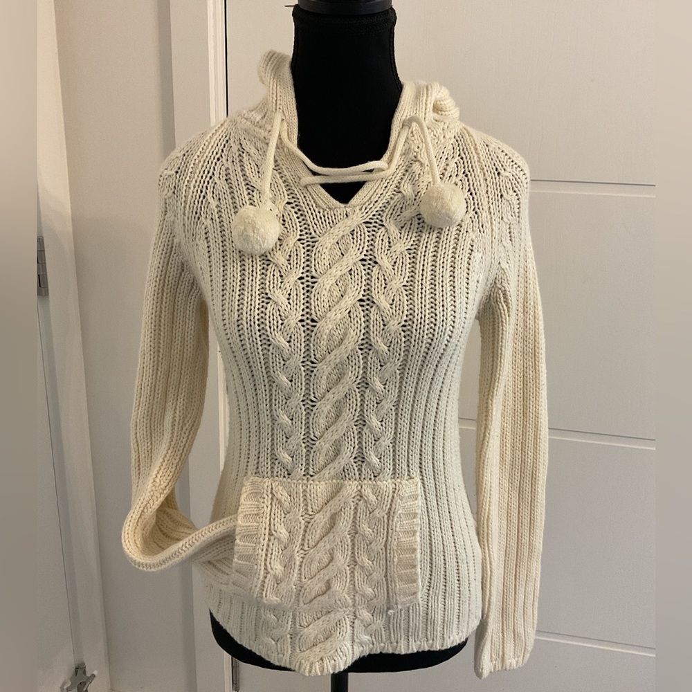Suzi Shier Cream Cable Pullover with hood and pouch pocket.